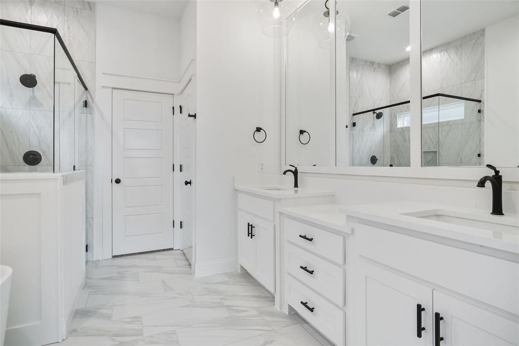 117 Sammy Street Godley, TX 76044 - Photo 12 of 27 a bathroom with a granite countertop sink mirror and double