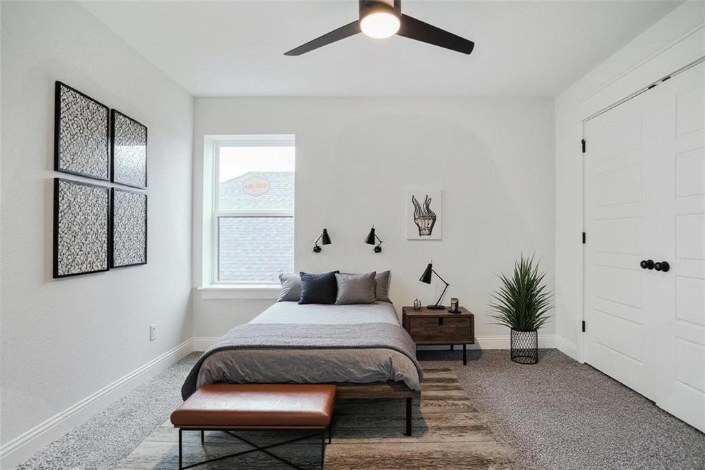 117 Sammy Street Godley, TX 76044 - Photo 20 of 27 a bedroom with a bed and a potted plant