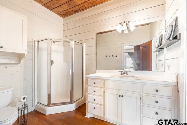 a bathroom with a sink a vanity and a mirror