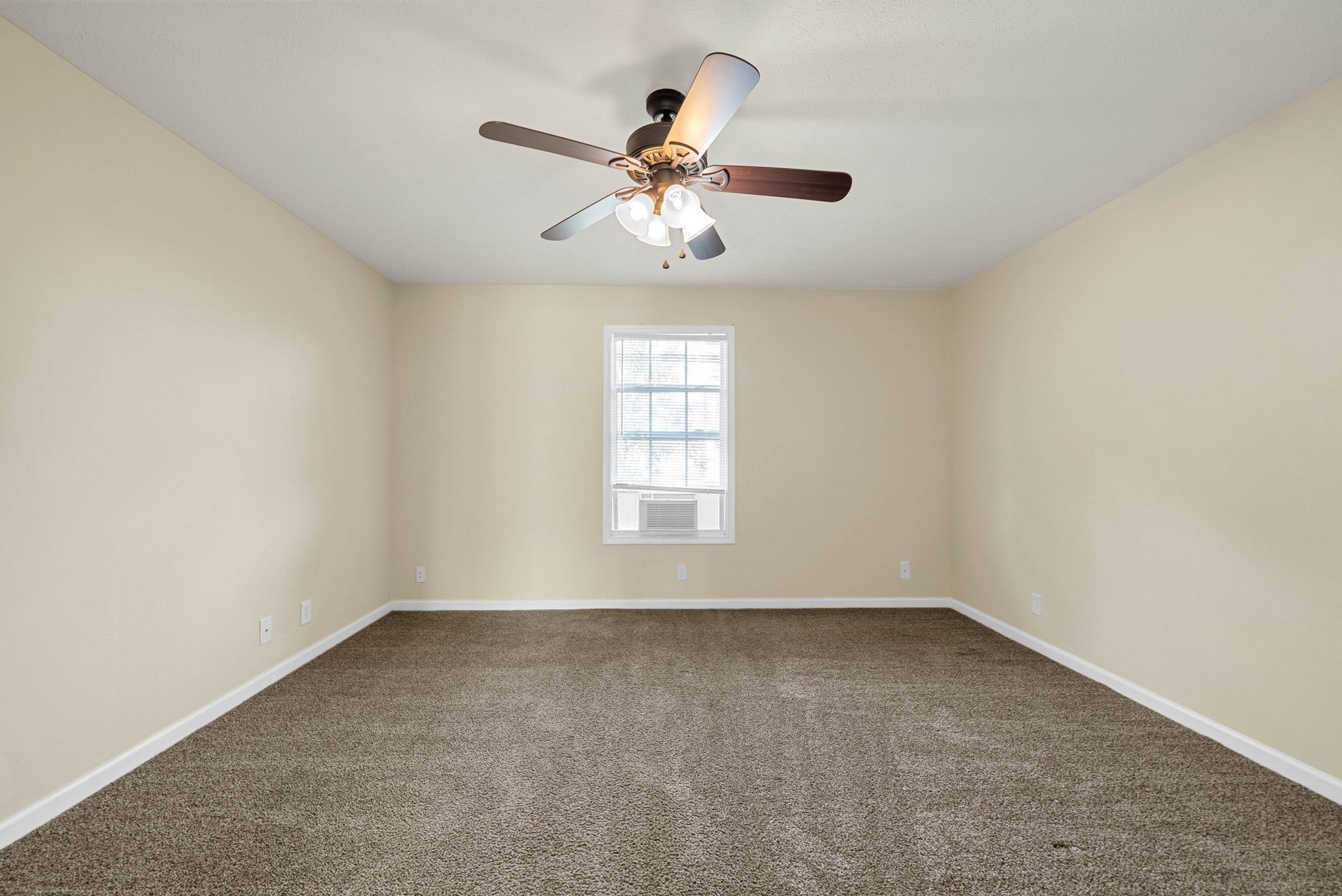 2331 Raleigh Court, Unit 7 Clarksville, TN 37043 - Photo 14 of 16 an empty room with a window and a fan