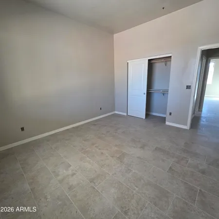 a view of an empty room and closet area