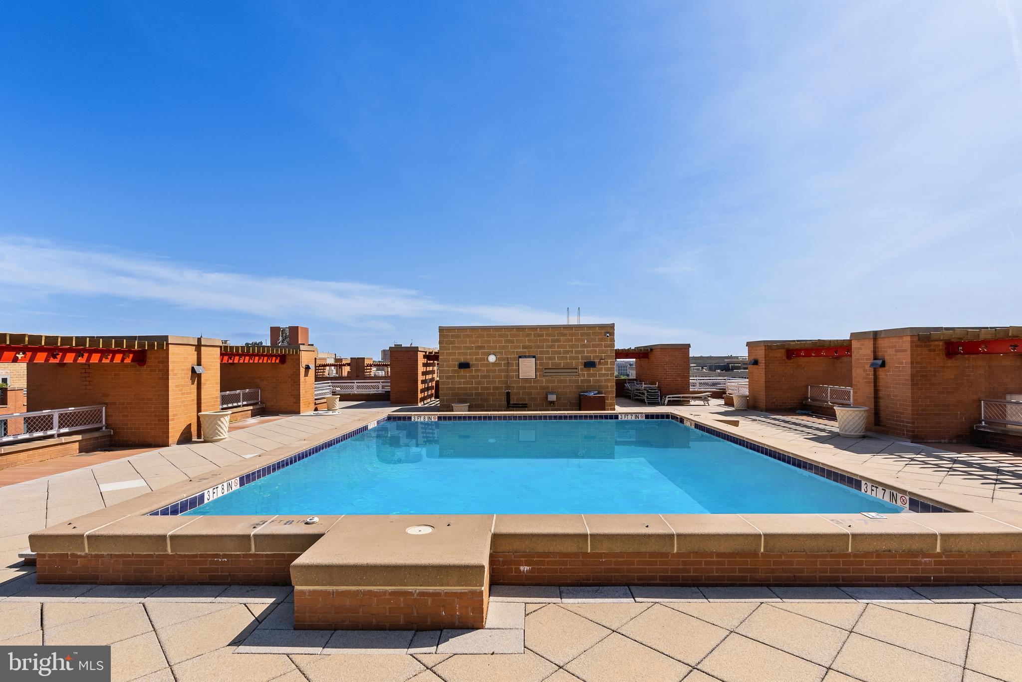 616 E Street Northwest, Unit 1019 Washington, DC 20004 - Photo 12 of 21 a living room with furniture and a flat screen tv