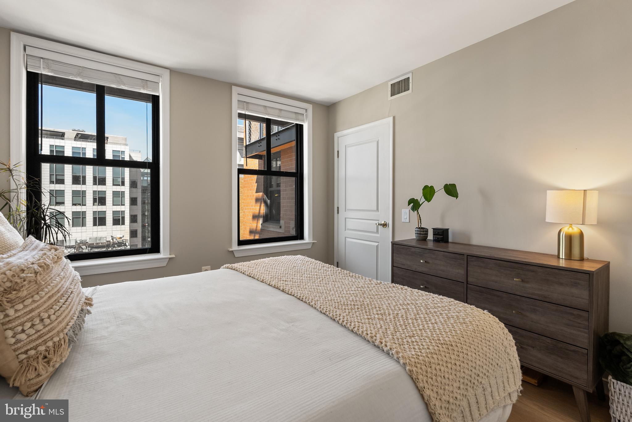 616 E Street Northwest, Unit 1019 Washington, DC 20004 - Photo 4 of 21 a bedroom with a bed and a window