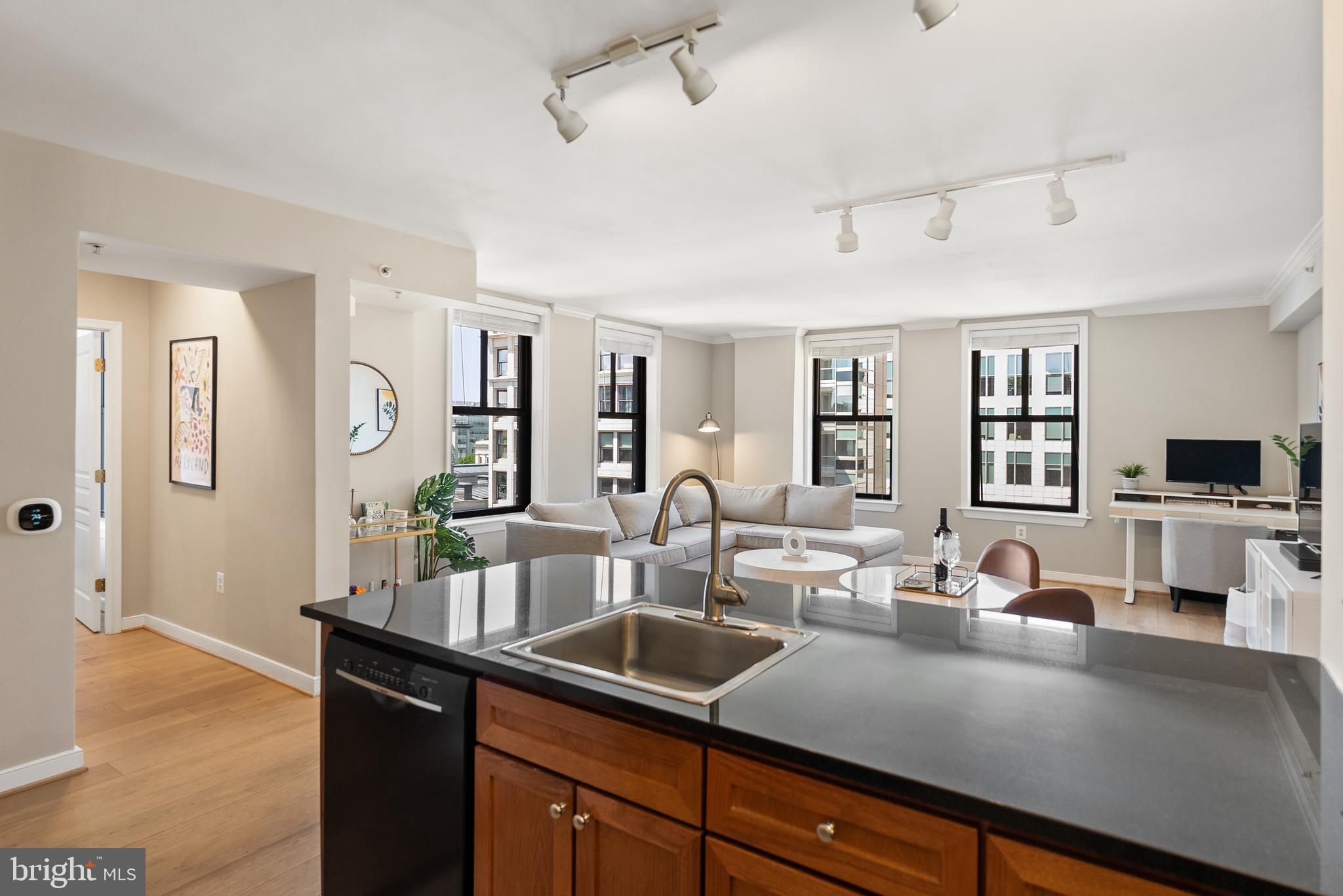 616 E Street Northwest, Unit 1019 Washington, DC 20004 - Photo 7 of 21 a kitchen with counter top space cabinets and stainless steel appliances