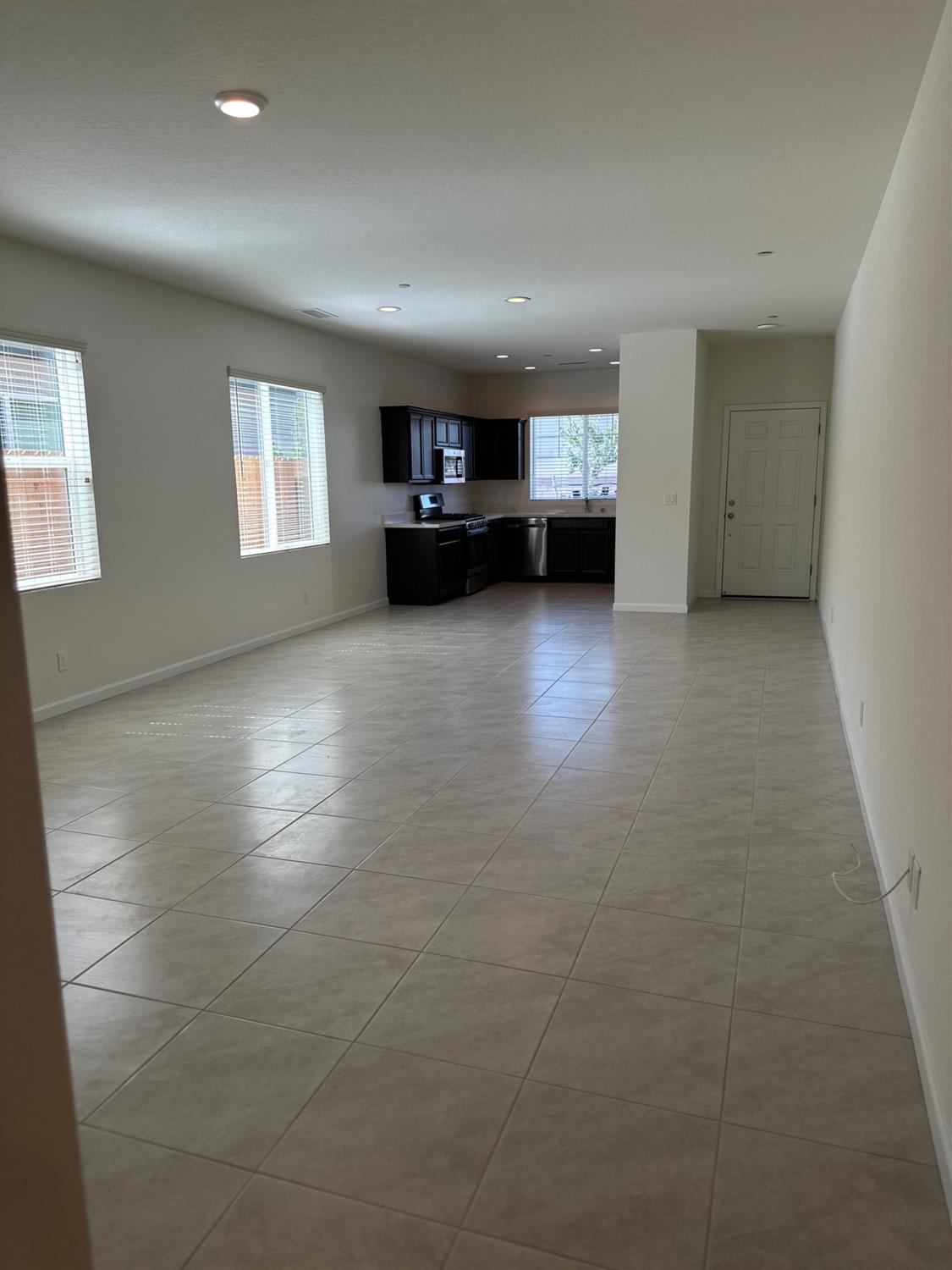 573 Green Lane Lemoore, CA 93245 - Photo 5 of 7 a view of empty room with a kitchen