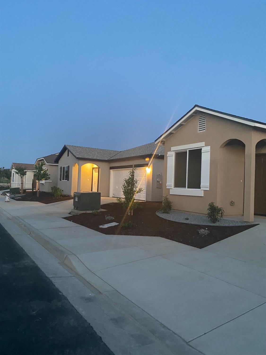 573 Green Lane Lemoore, CA 93245 - Photo 7 of 7 a front view of a house with a yard