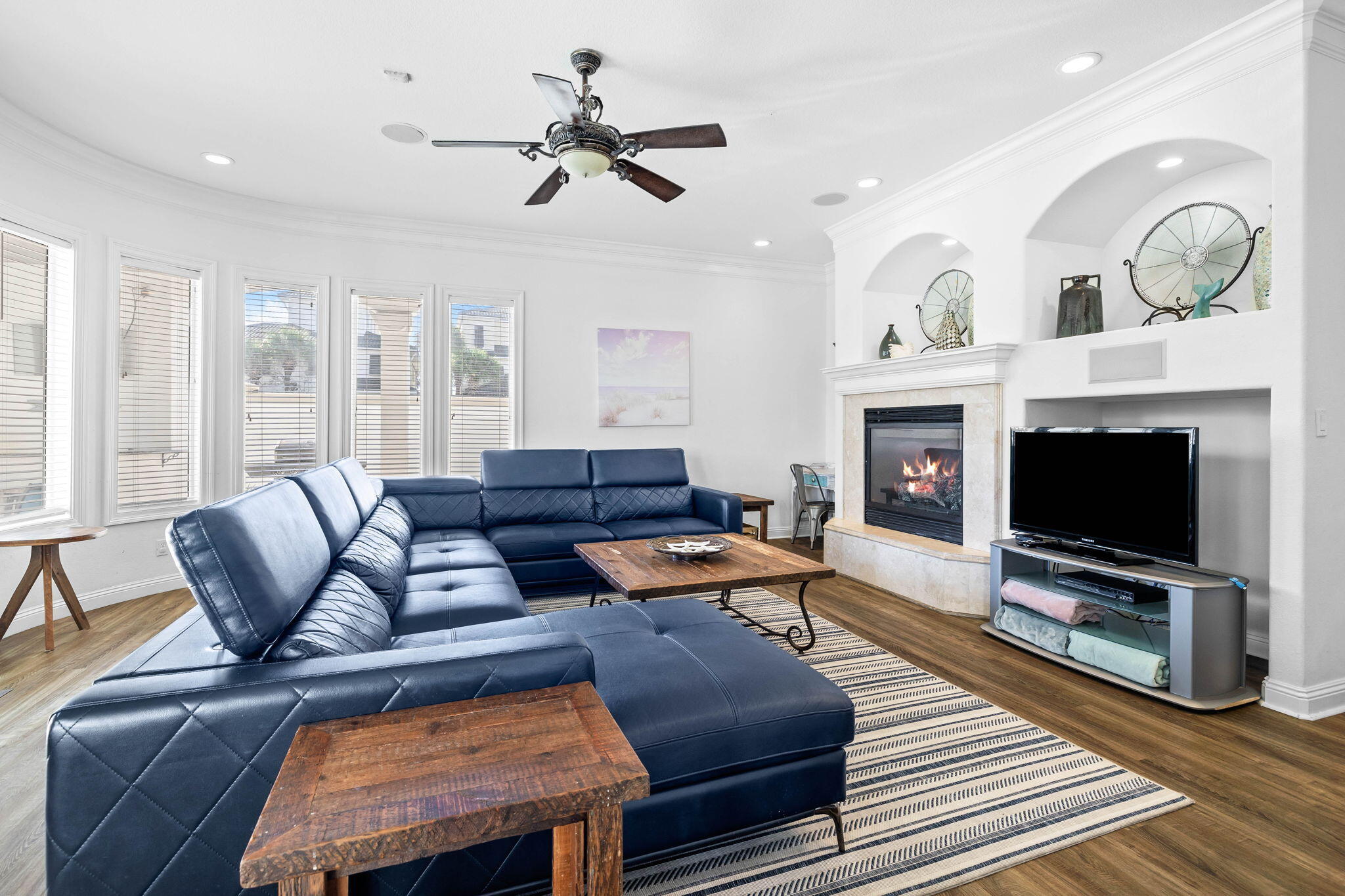 48 Tranquility Lane Destin, FL 32541 - Photo 15 of 45 a living room with furniture a flat screen tv and a fireplace