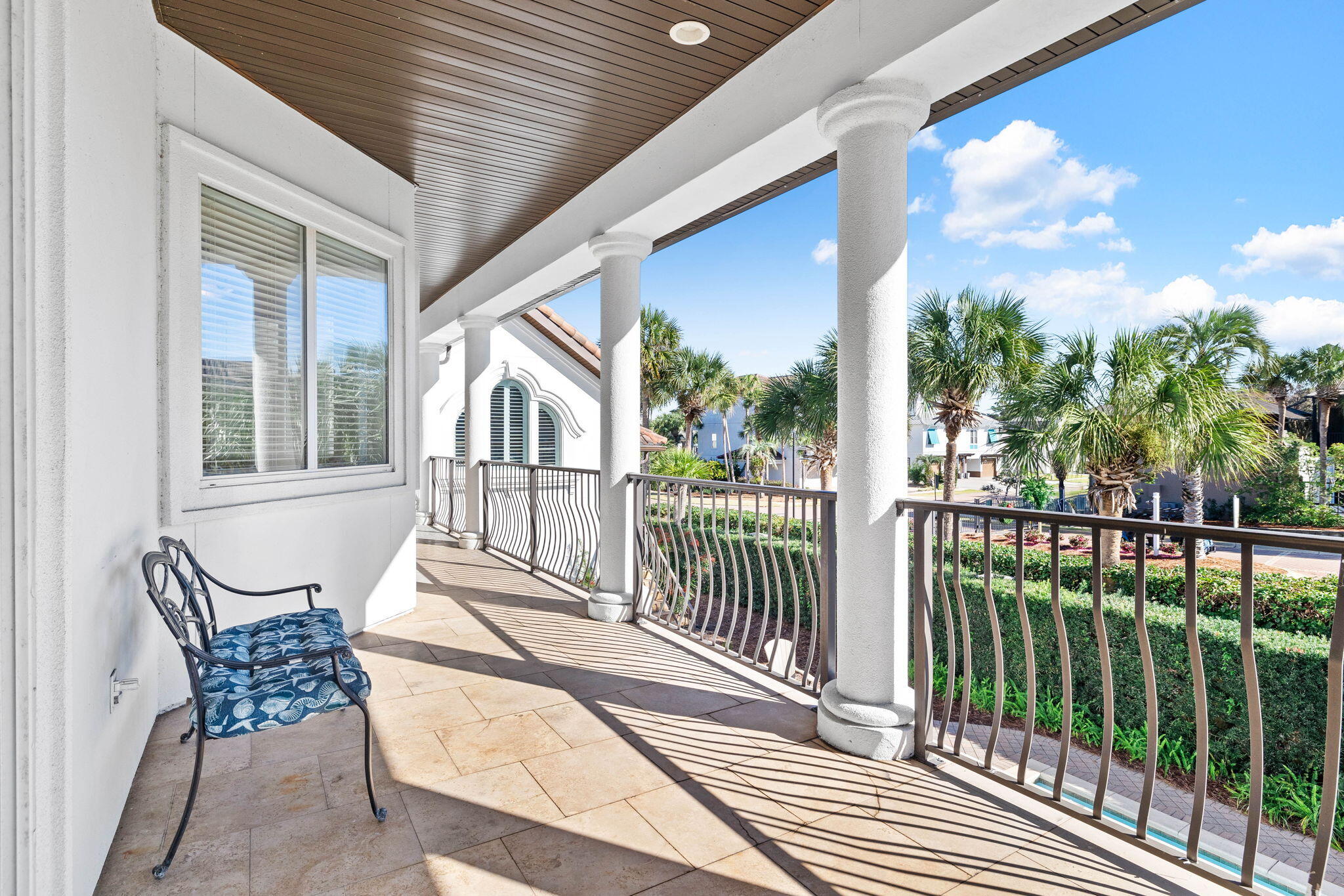 48 Tranquility Lane Destin, FL 32541 - Photo 26 of 45 a view of a chair and tables in the balcony