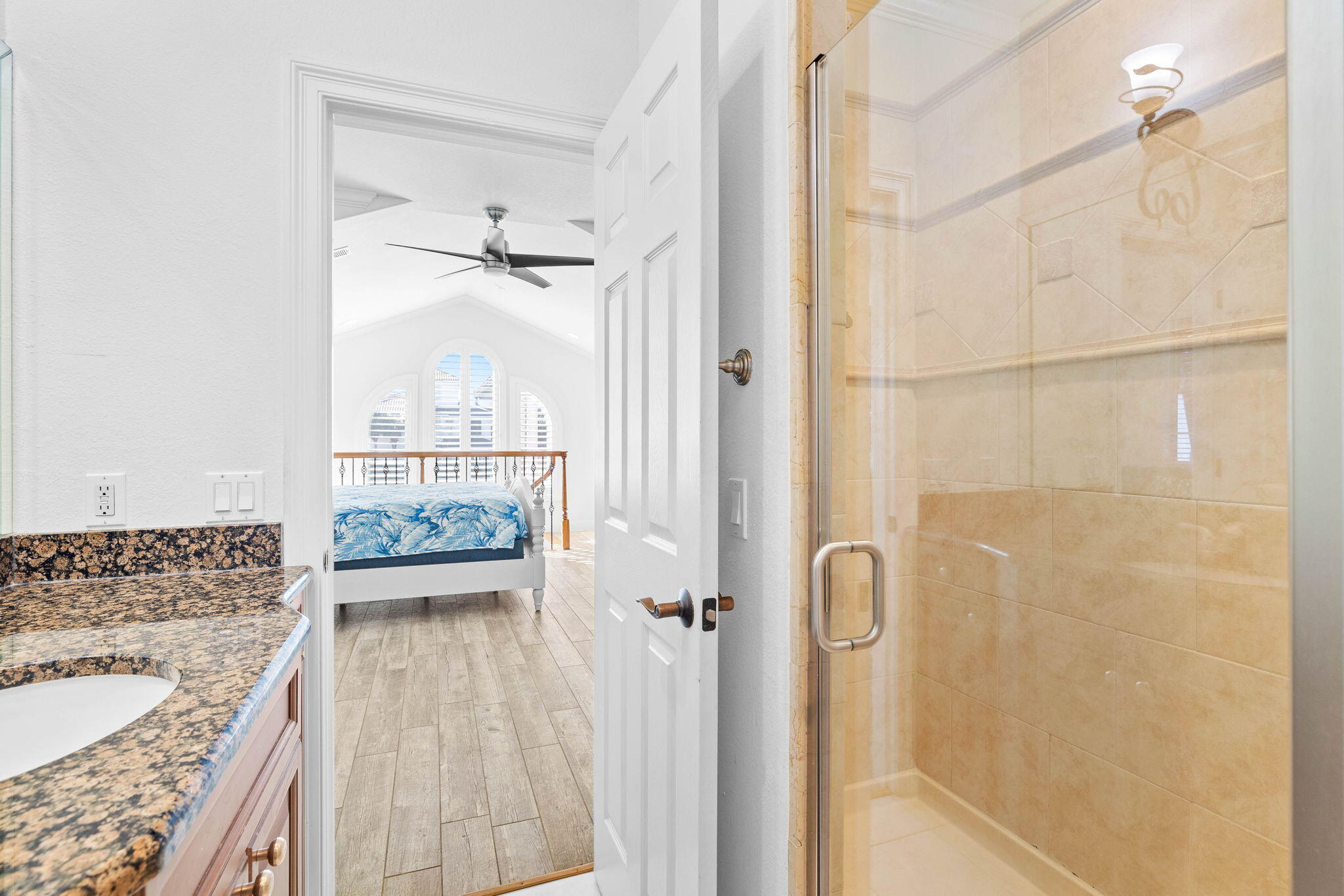 48 Tranquility Lane Destin, FL 32541 - Photo 33 of 45 a bathroom with a granite countertop sink a mirror and shower