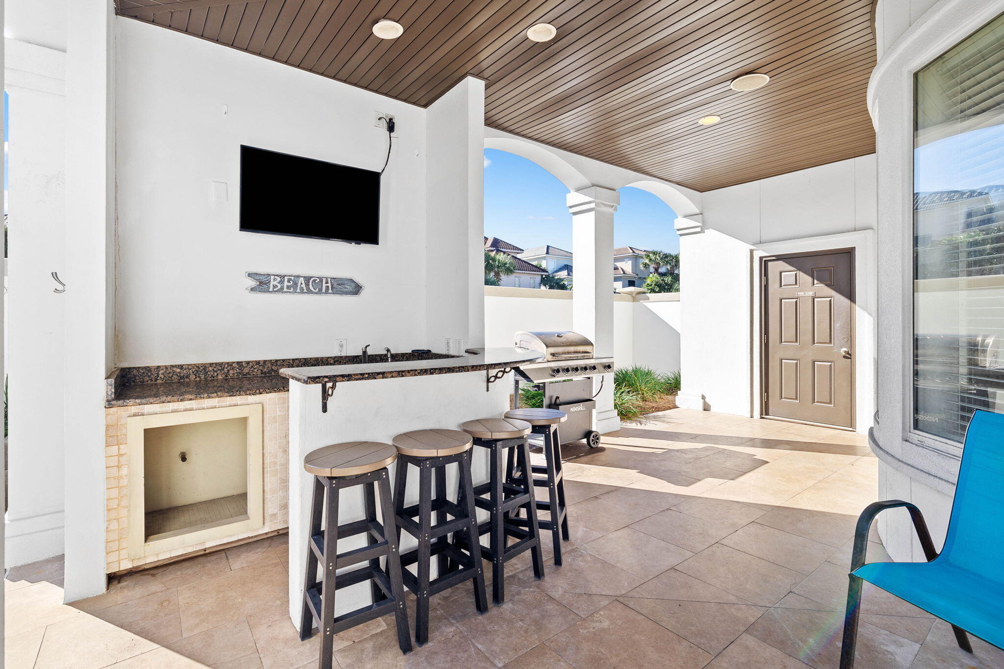 48 Tranquility Lane Destin, FL 32541 - Photo 39 of 45 a living room with furniture a flat screen tv and a floor to ceiling window