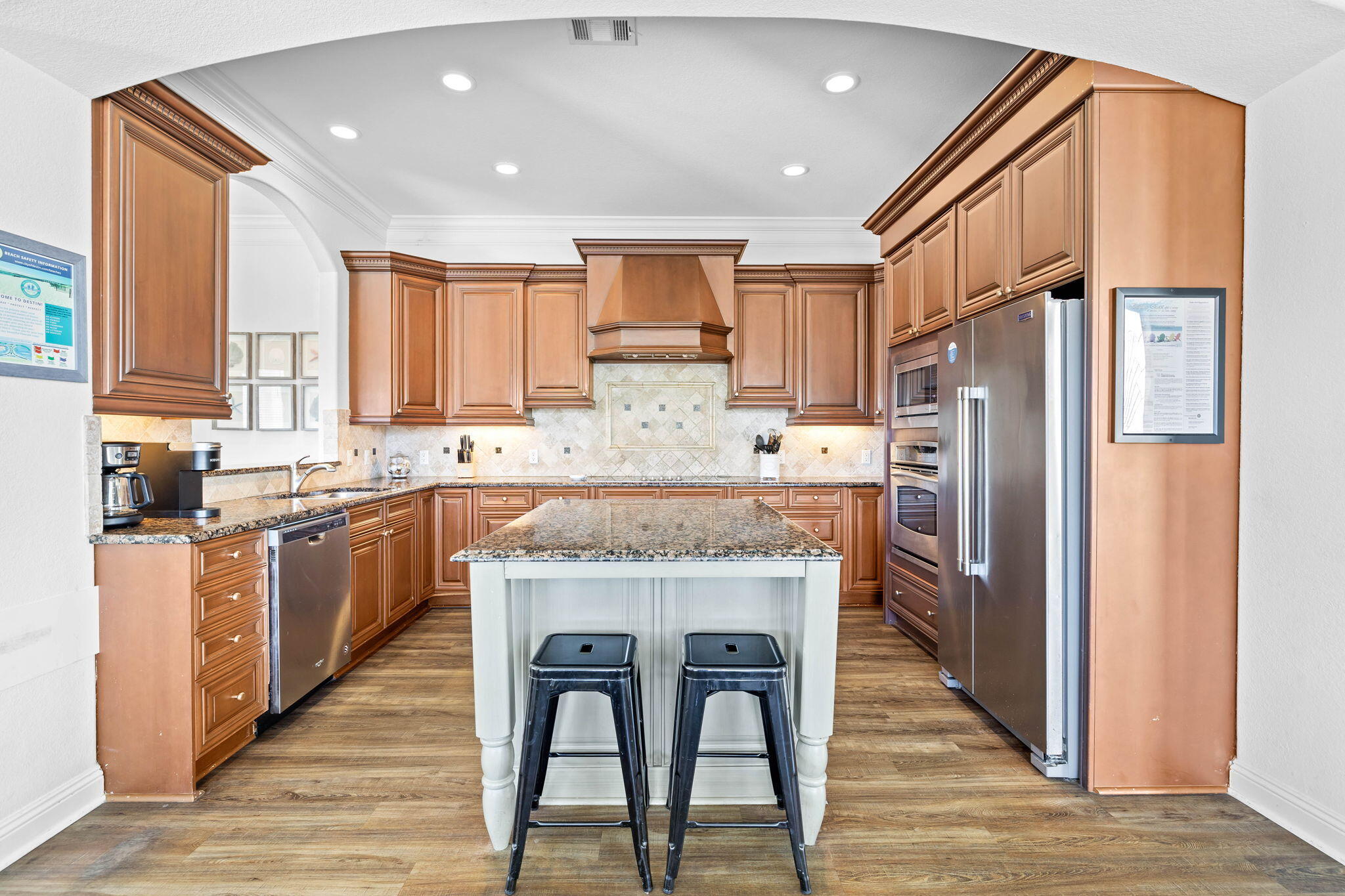 48 Tranquility Lane Destin, FL 32541 - Photo 10 of 45 a kitchen with stainless steel appliances granite countertop a refrigerator a stove top oven a sink and dishwasher