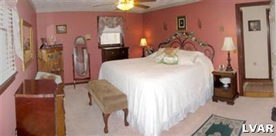 2327 Mountain Road Slatington, PA 18080 - Photo 5 of 9 a bedroom with a bed and a chandelier