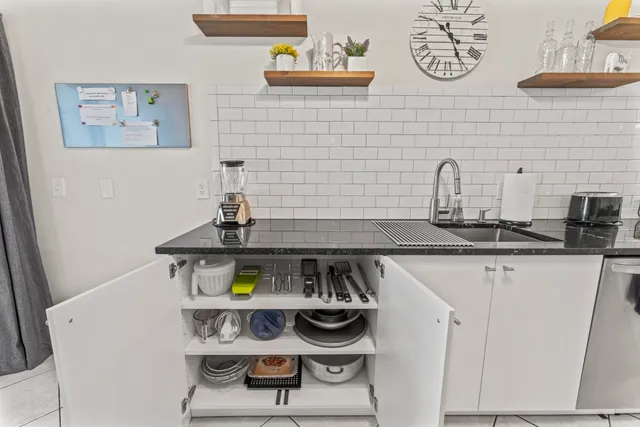 a bathroom with a stove and cabinets