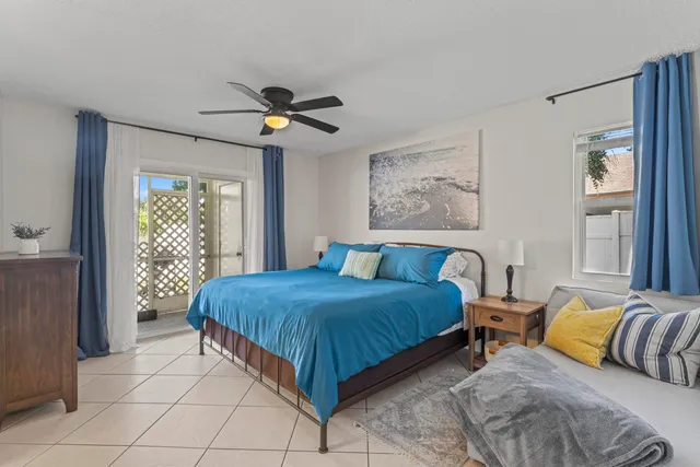 a bedroom with a bed couch and a window