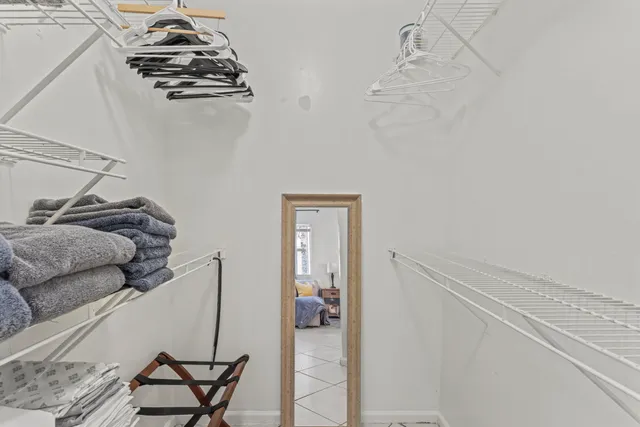 a bedroom with a bed and a desk