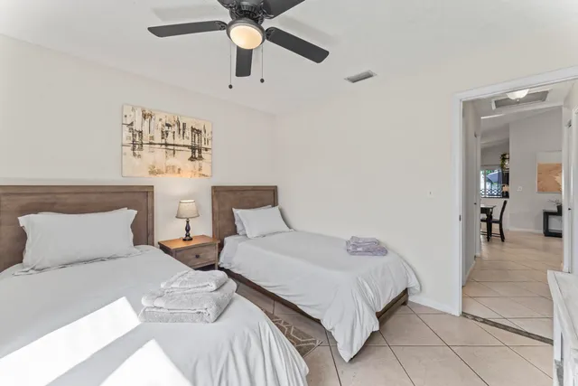 a bedroom with bed and window