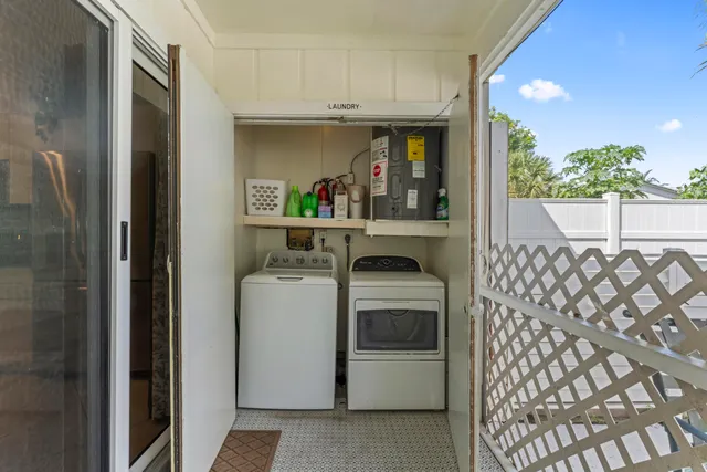 a view of a patio with a table and chairs