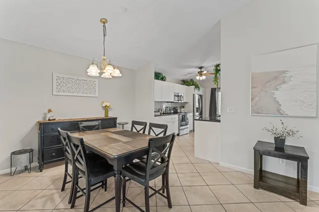 a view of a dining room and chandelier