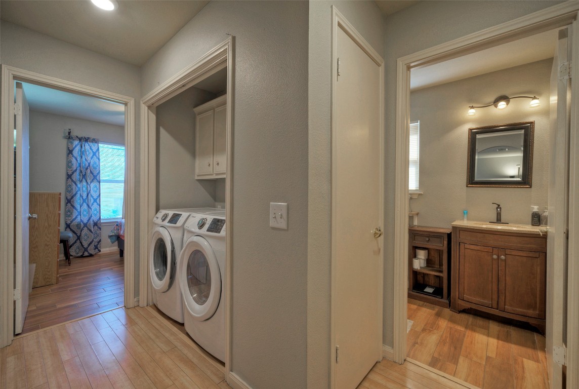 7208 Bennett Avenue Austin, TX 78752 - Photo 18 of 30 a view of a storage and utility room with washer and dryer