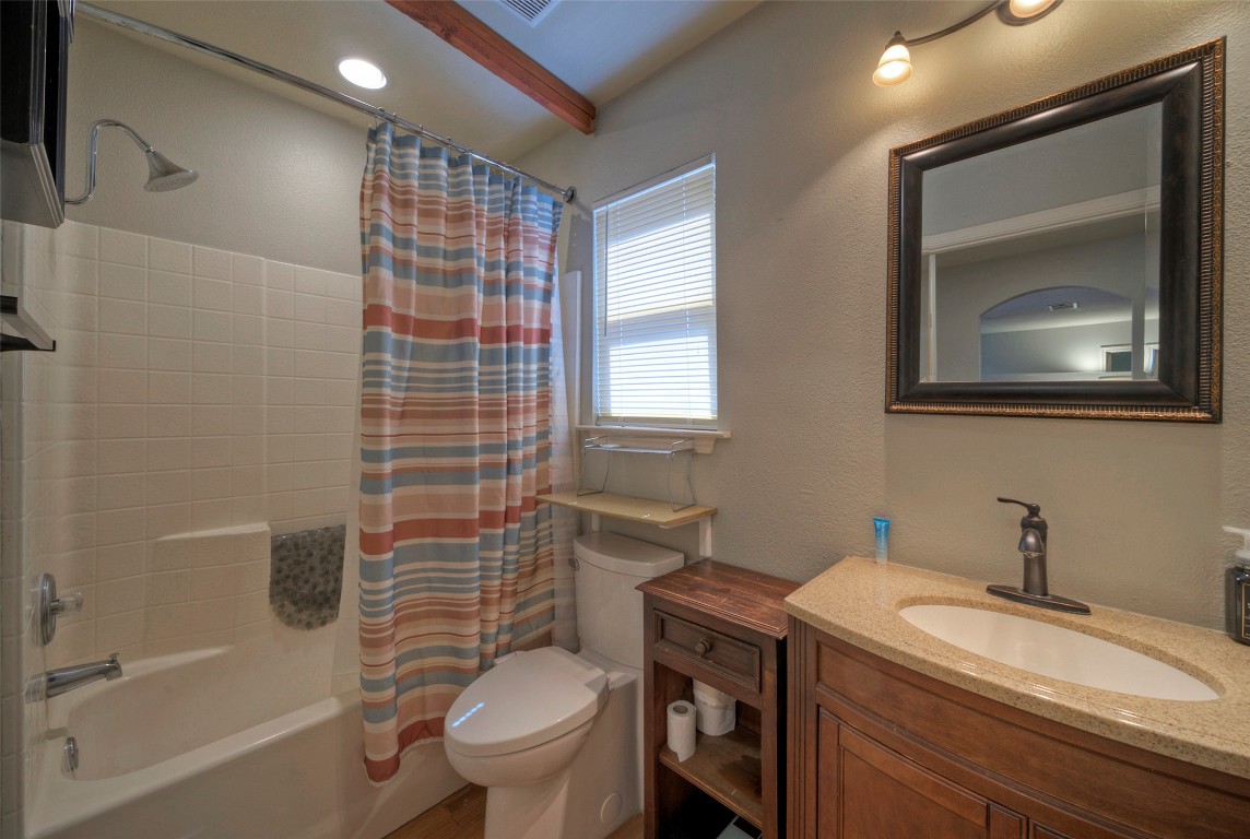 7208 Bennett Avenue Austin, TX 78752 - Photo 23 of 30 a bathroom with a sink toilet and shower