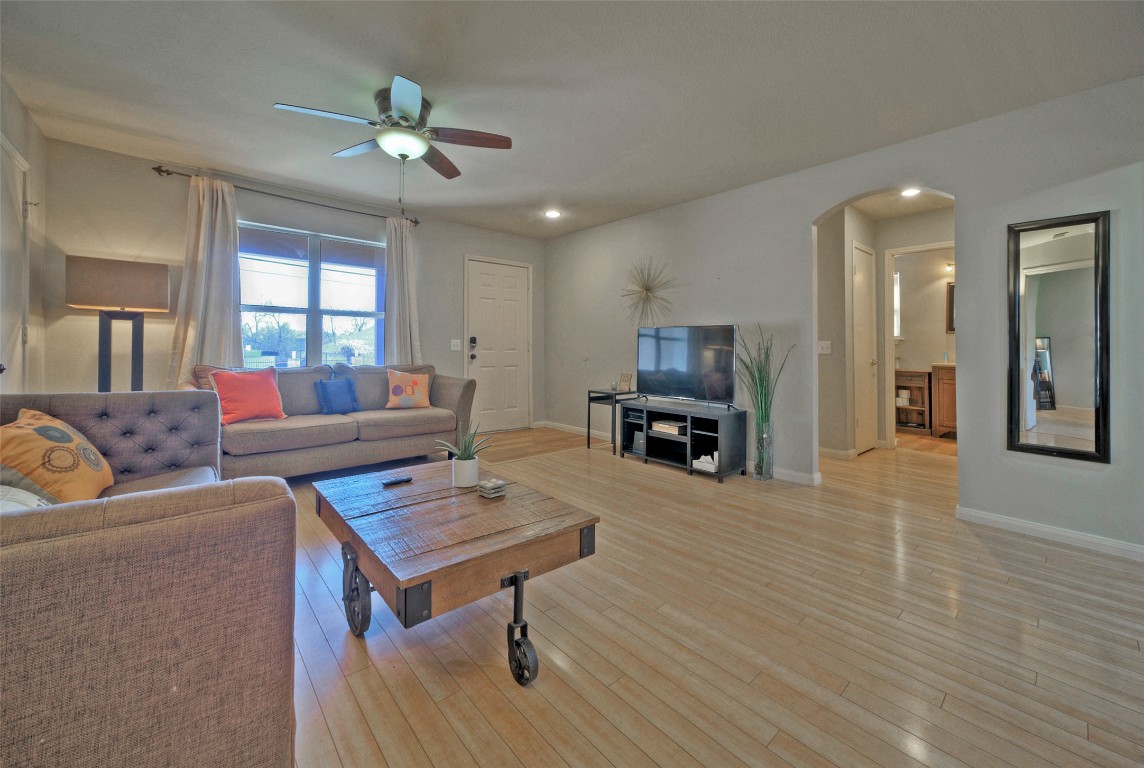 7208 Bennett Avenue Austin, TX 78752 - Photo 7 of 30 a living room with furniture and a wooden floor