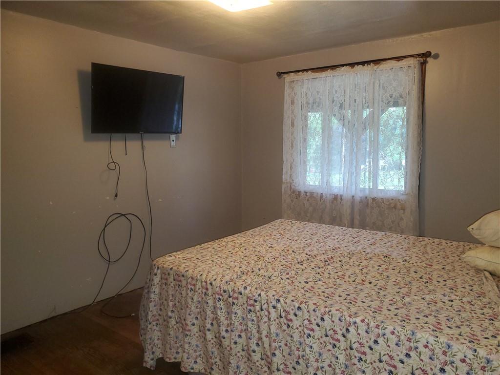 132 Laird's Crossing Road Worthington, PA 16262 - Photo 12 of 20 a bedroom with a bed and a flat tv screen on the dresser