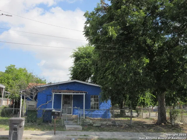 a view of a brick house with a large windows