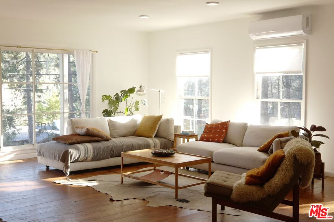 53505 Tollgate Road Idyllwild, CA 92549 - Photo 1 of 42 a living room with furniture and a large window