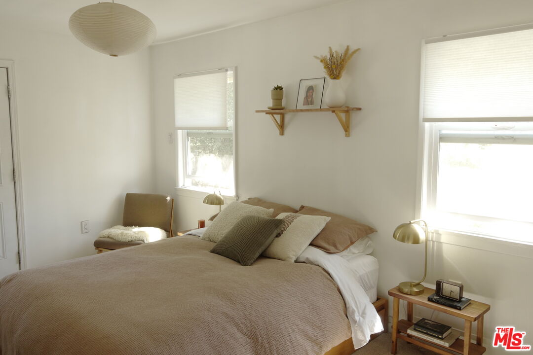 53505 Tollgate Road Idyllwild, CA 92549 - Photo 13 of 42 a bedroom with a bed and a window