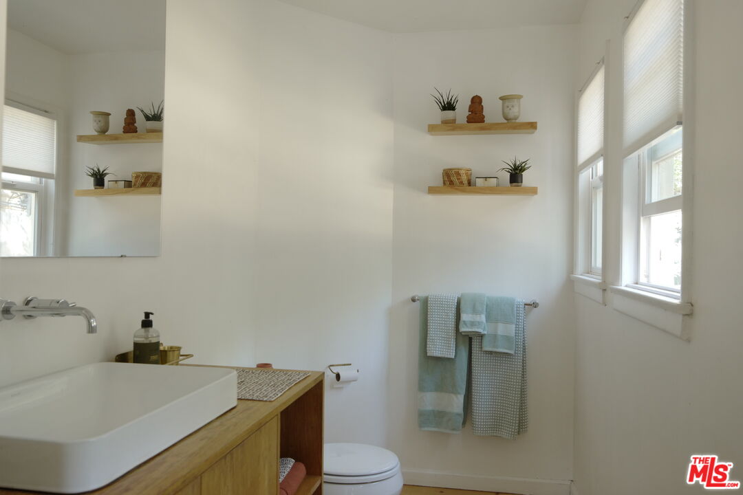 53505 Tollgate Road Idyllwild, CA 92549 - Photo 16 of 42 a bathroom with a sink and a toilet