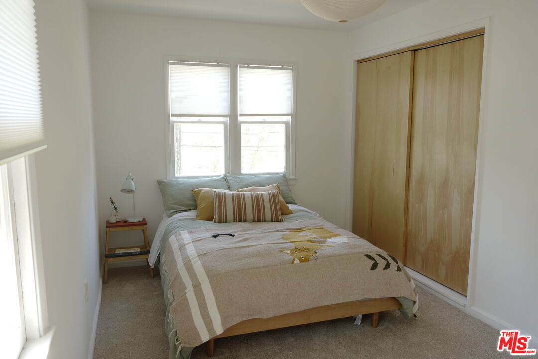 53505 Tollgate Road Idyllwild, CA 92549 - Photo 19 of 42 a bed sitting in a bedroom next to a window