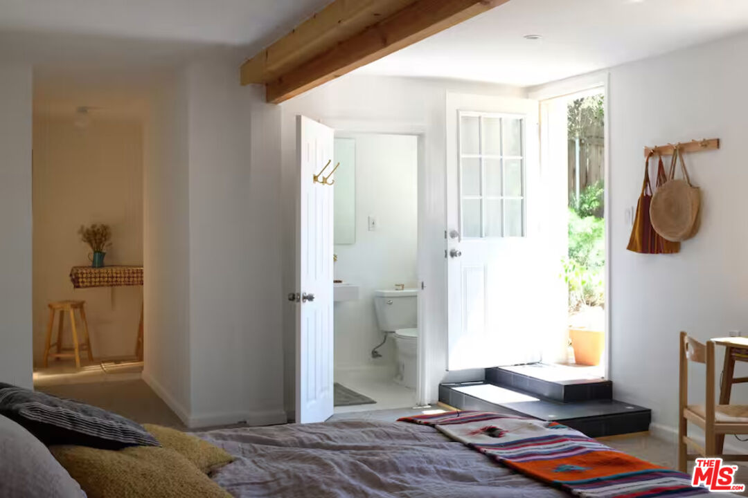 53505 Tollgate Road Idyllwild, CA 92549 - Photo 23 of 42 a bedroom with a bed and wooden floor