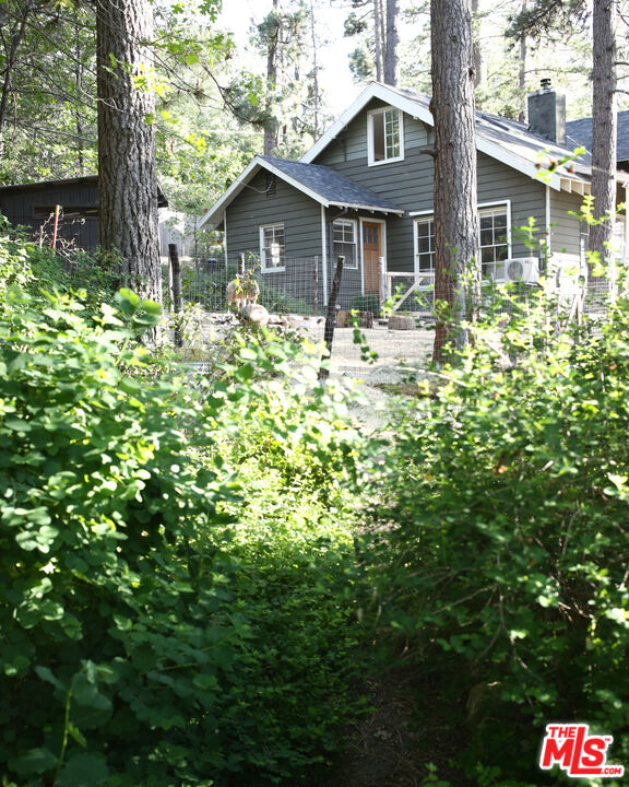 53505 Tollgate Road Idyllwild, CA 92549 - Photo 37 of 42 a front view of a house with a garden
