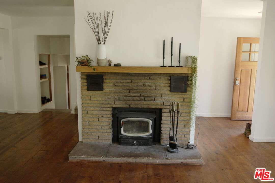 53505 Tollgate Road Idyllwild, CA 92549 - Photo 8 of 42 a living room with a fireplace in it