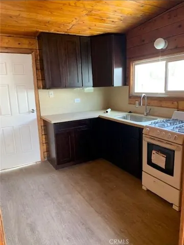 a kitchen with a sink and a stove