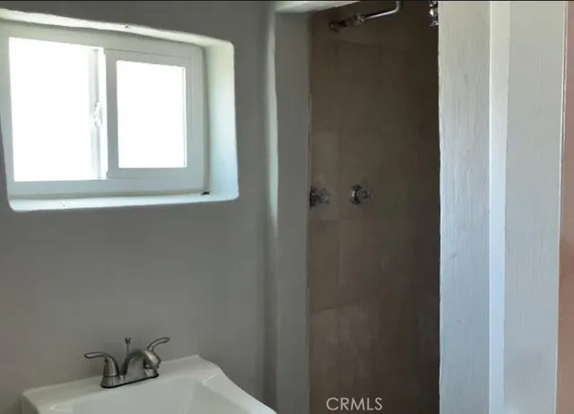 a bathroom with a sink and a window