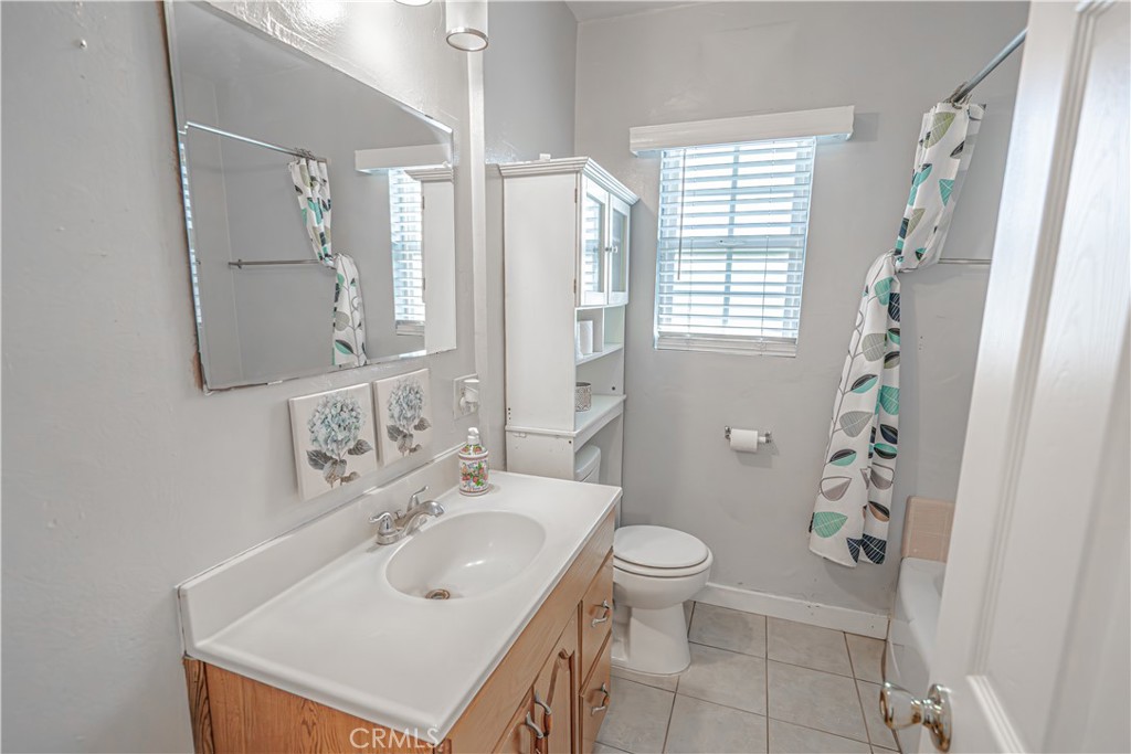 150 East 233rd Street Carson, CA 90745 - Photo 12 of 22 a bathroom with a sink toilet and shower