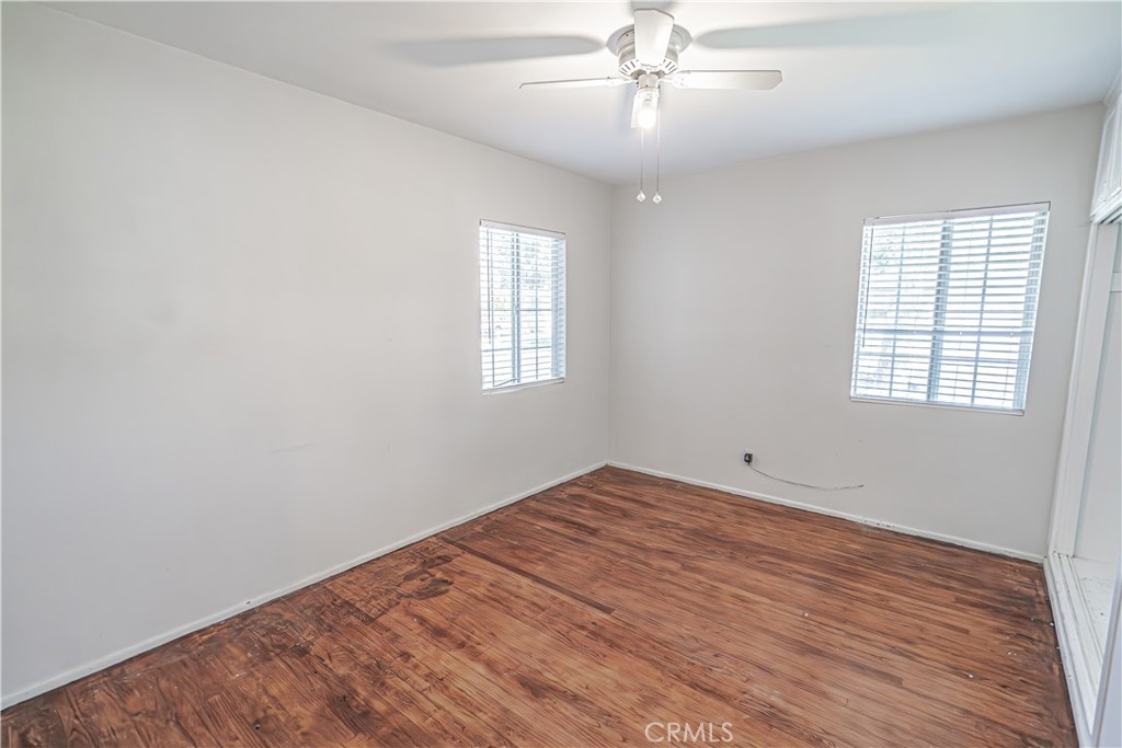 150 East 233rd Street Carson, CA 90745 - Photo 14 of 22 wooden floor in an empty room with a window