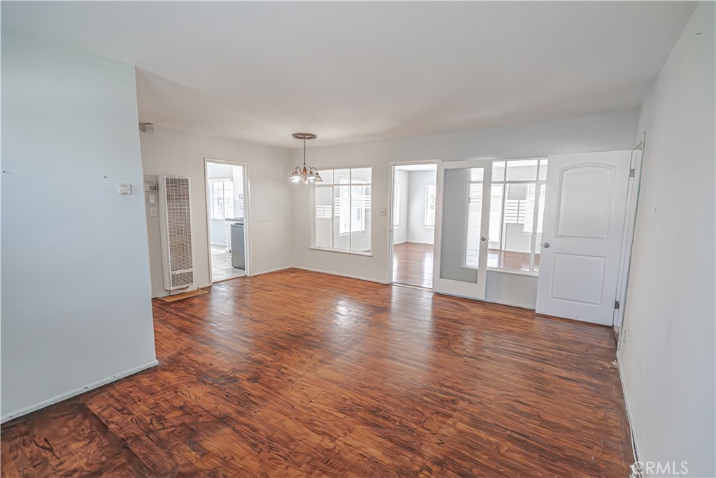 150 East 233rd Street Carson, CA 90745 - Photo 5 of 22 a view of an empty room with window and wooden floor