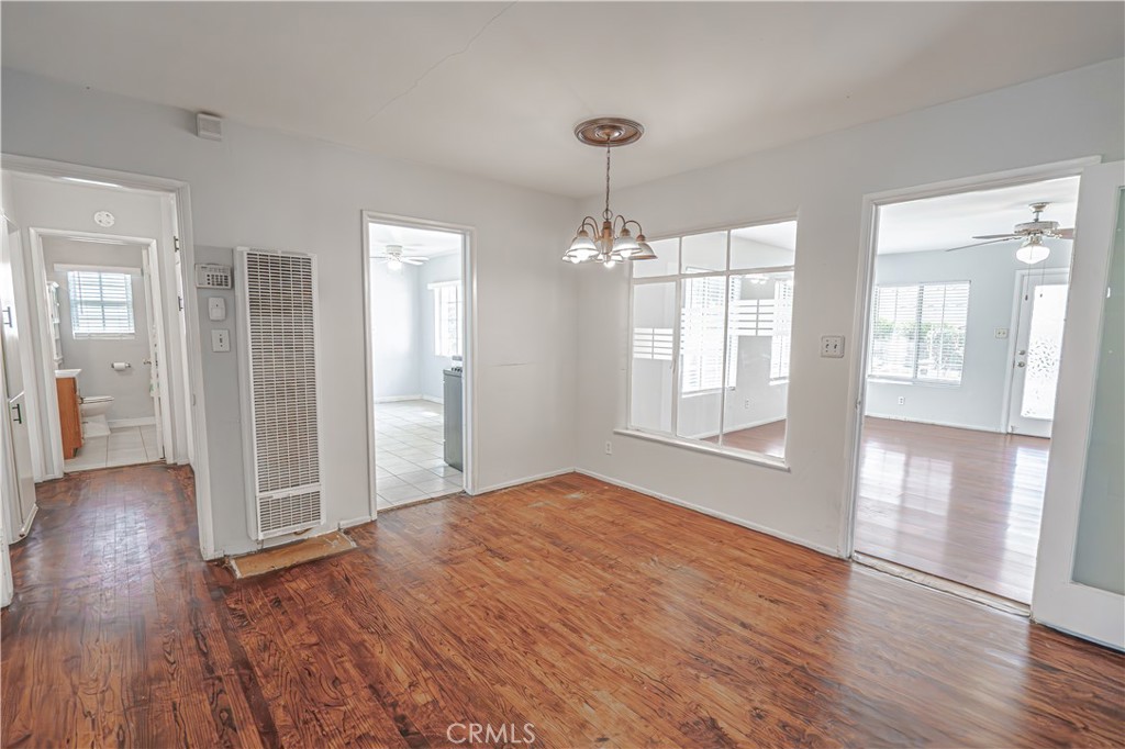 150 East 233rd Street Carson, CA 90745 - Photo 6 of 22 a view of an empty room with wooden floor and a window