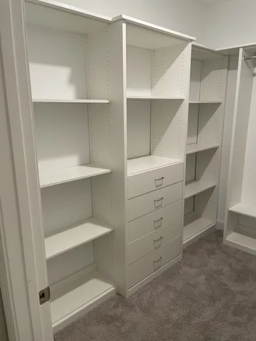 a view of an empty walk in closet
