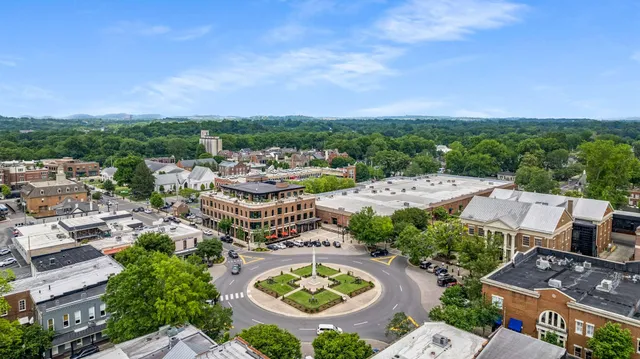 an aerial view of residential houses and outdoor space