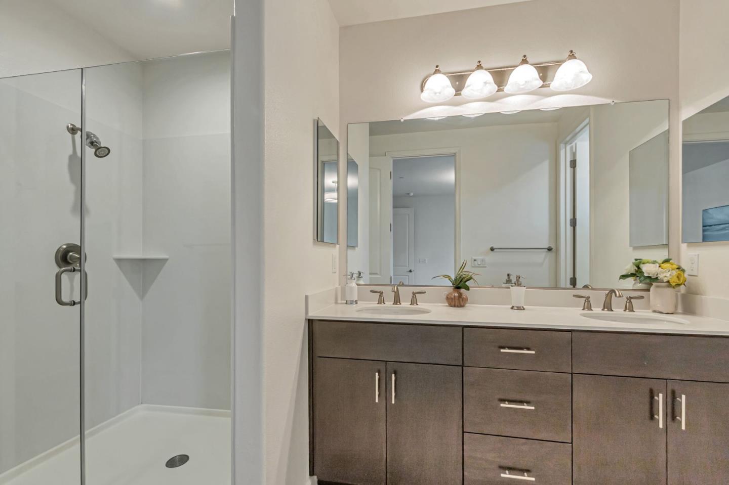 1890 Trento Loop Milpitas, CA 95035 - Photo 18 of 39 a bathroom with a double vanity sink mirror and shower