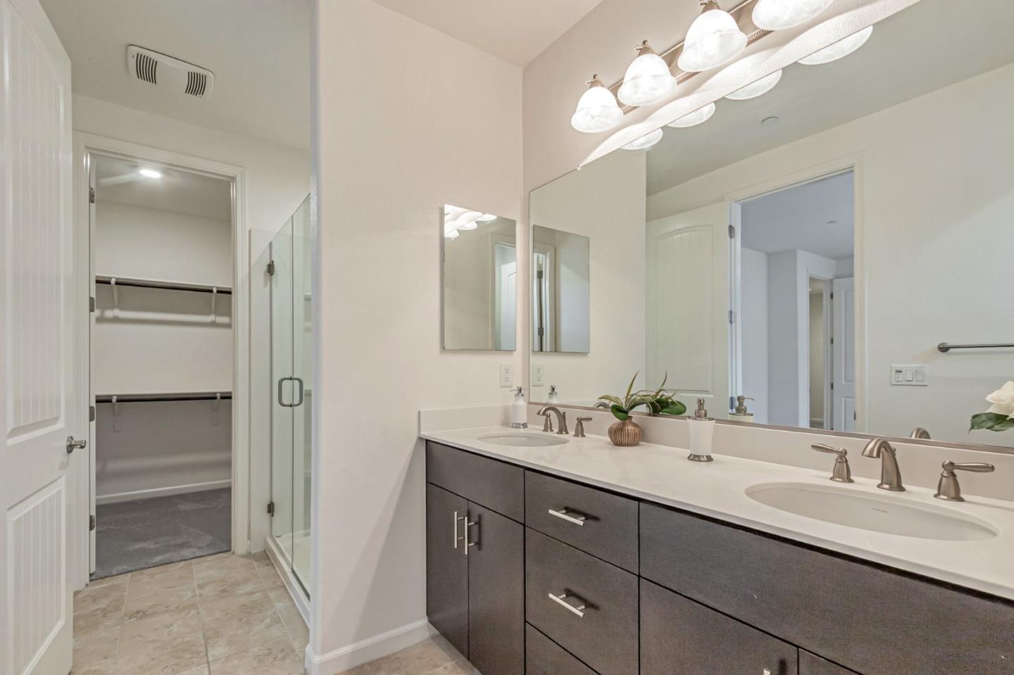 1890 Trento Loop Milpitas, CA 95035 - Photo 21 of 39 a bathroom with a double vanity sink and a mirror