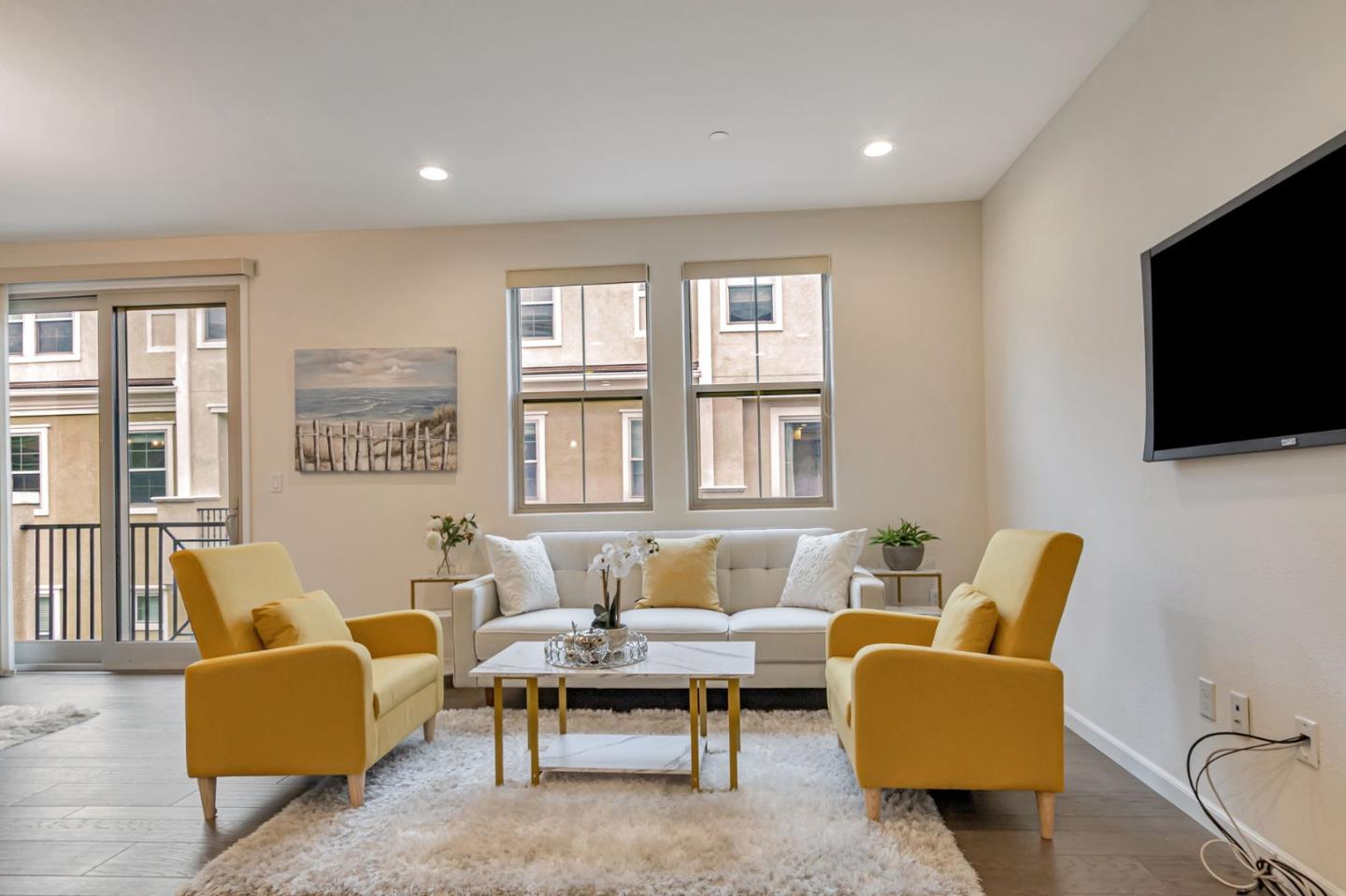 1890 Trento Loop Milpitas, CA 95035 - Photo 3 of 39 a living room with furniture and a flat screen tv