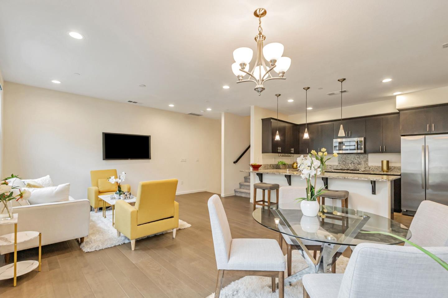 1890 Trento Loop Milpitas, CA 95035 - Photo 8 of 39 a living room with furniture kitchen view and a chandelier