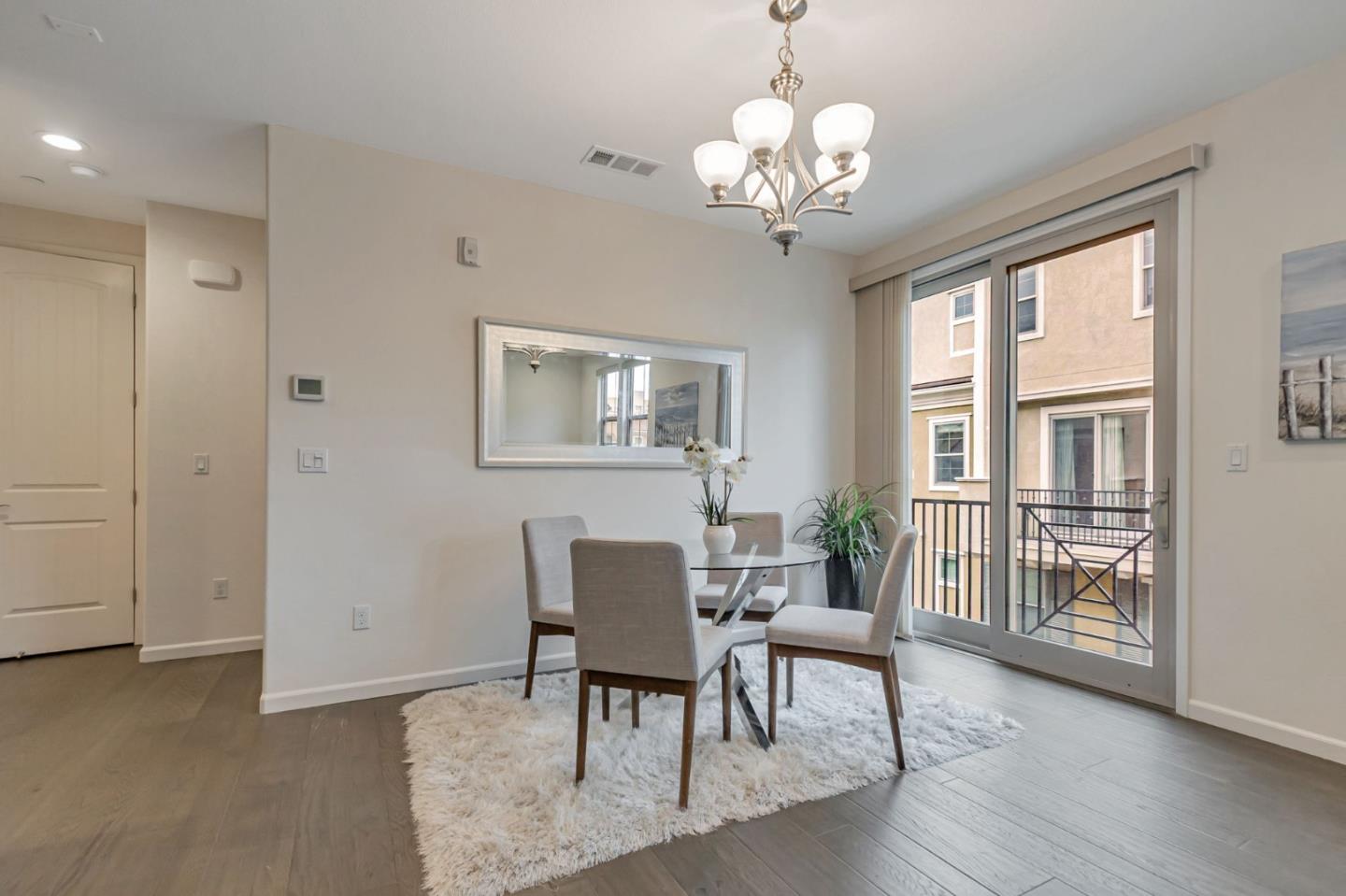 1890 Trento Loop Milpitas, CA 95035 - Photo 9 of 39 a view of a dining room with furniture window and wooden floor