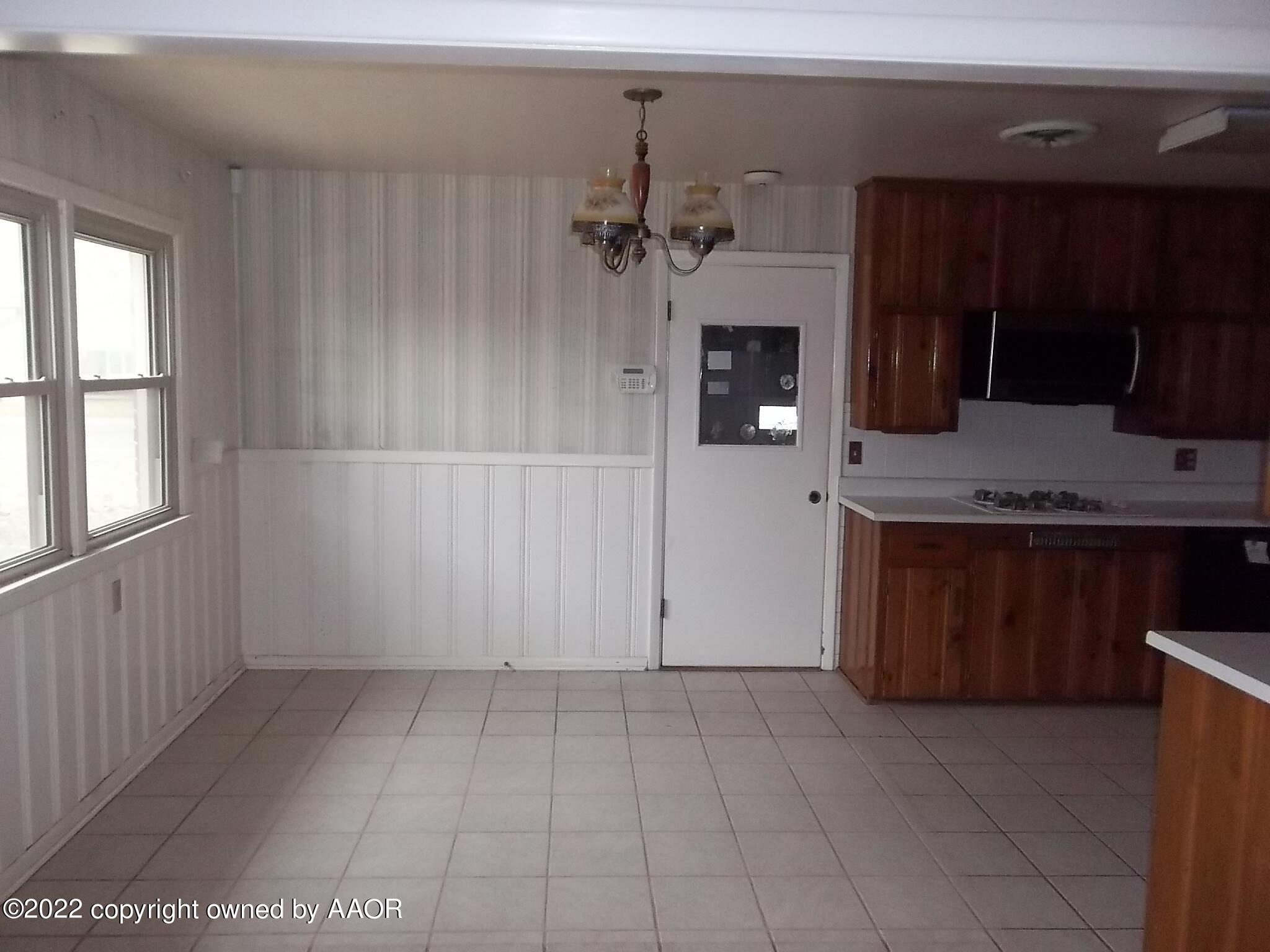 4010 Tucson Drive Amarillo, TX 79109 - Photo 15 of 23 a view of a kitchen with a sink and cabinets