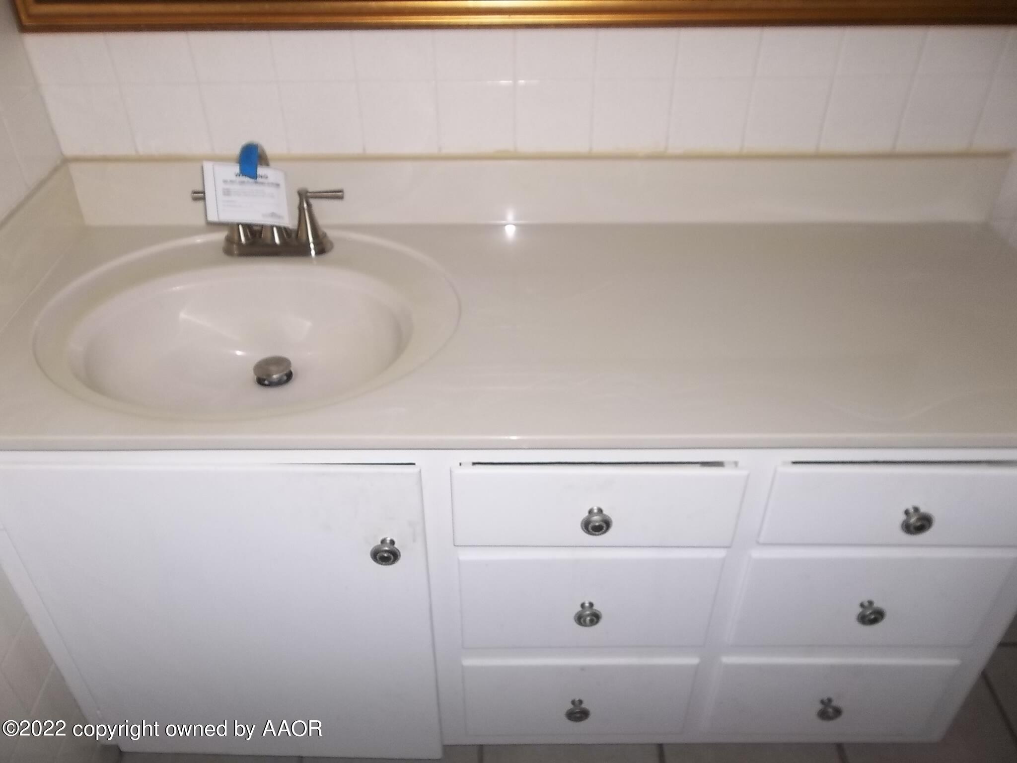 4010 Tucson Drive Amarillo, TX 79109 - Photo 18 of 23 a bathroom with a sink