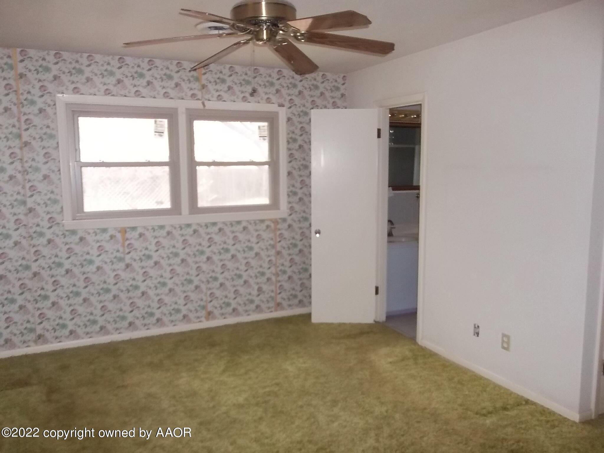 4010 Tucson Drive Amarillo, TX 79109 - Photo 19 of 23 a view of an empty room with a window